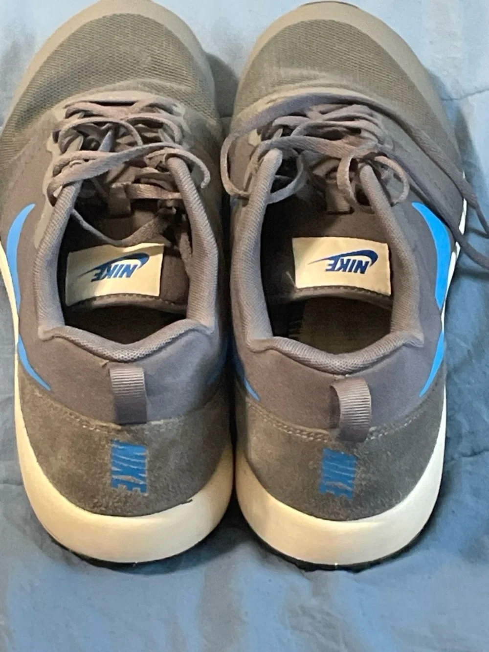 Nike Gray Sneakers with Blue Swoosh